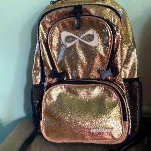I’m selling a cheerleader, backpack, color, gold and white and black.